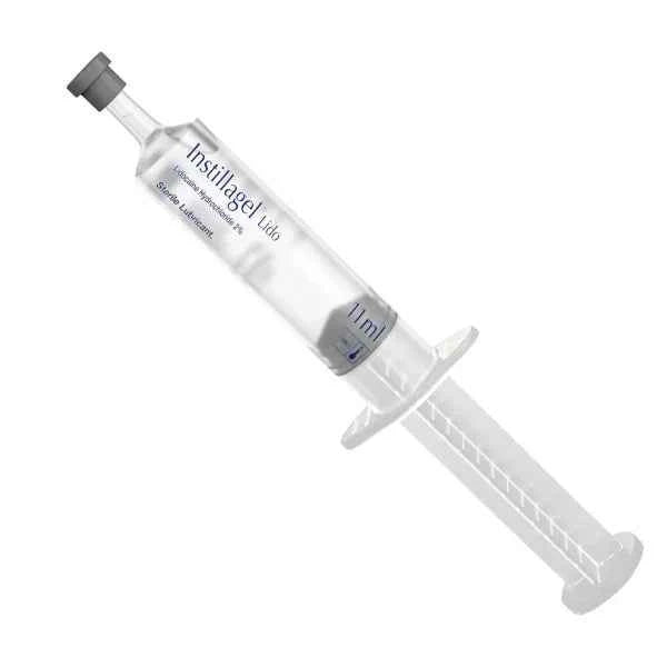 A single-use, 11ml plastic syringe filled with Instillagel Lido sterile lube sits upright on a white background. The syringe has a label with the product name, dosage information (11ml), and sterility symbol.