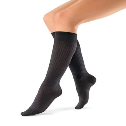 Pair of black JOBST soSoft Knee High Mild Compression Stockings (8-15 mmHg)