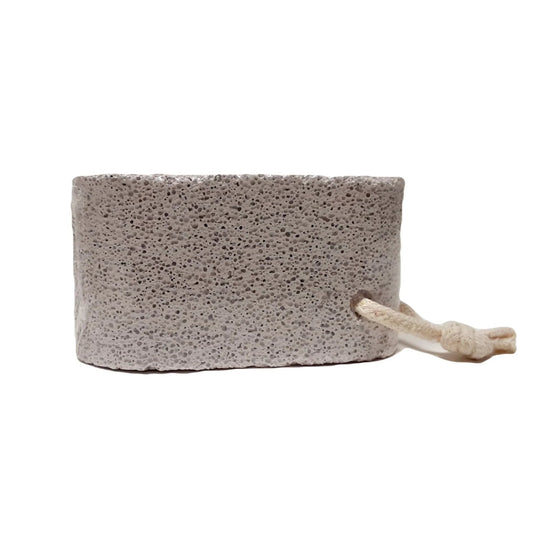 Curved pumice stone for exfoliating rough, dry skin on feet.